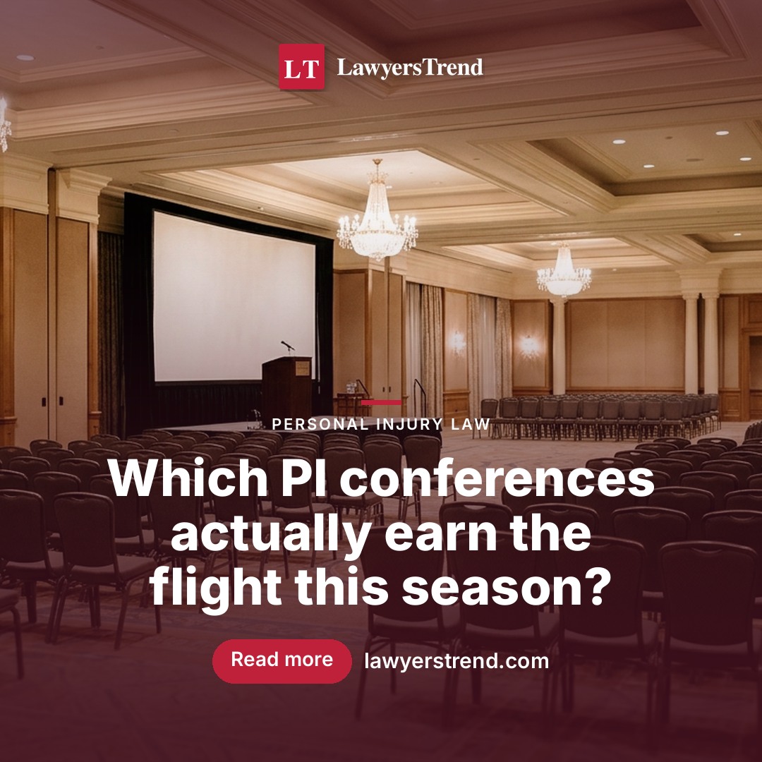 An empty conference ballroom arranged with rows of chairs facing a lectern and blank projection screen before a continuing legal education session.