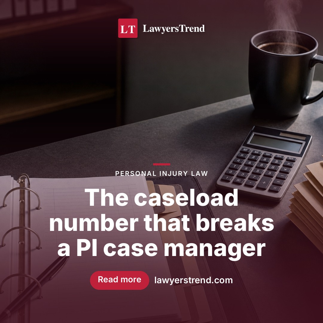 Case manager reviewing files at a desk with multiple monitors