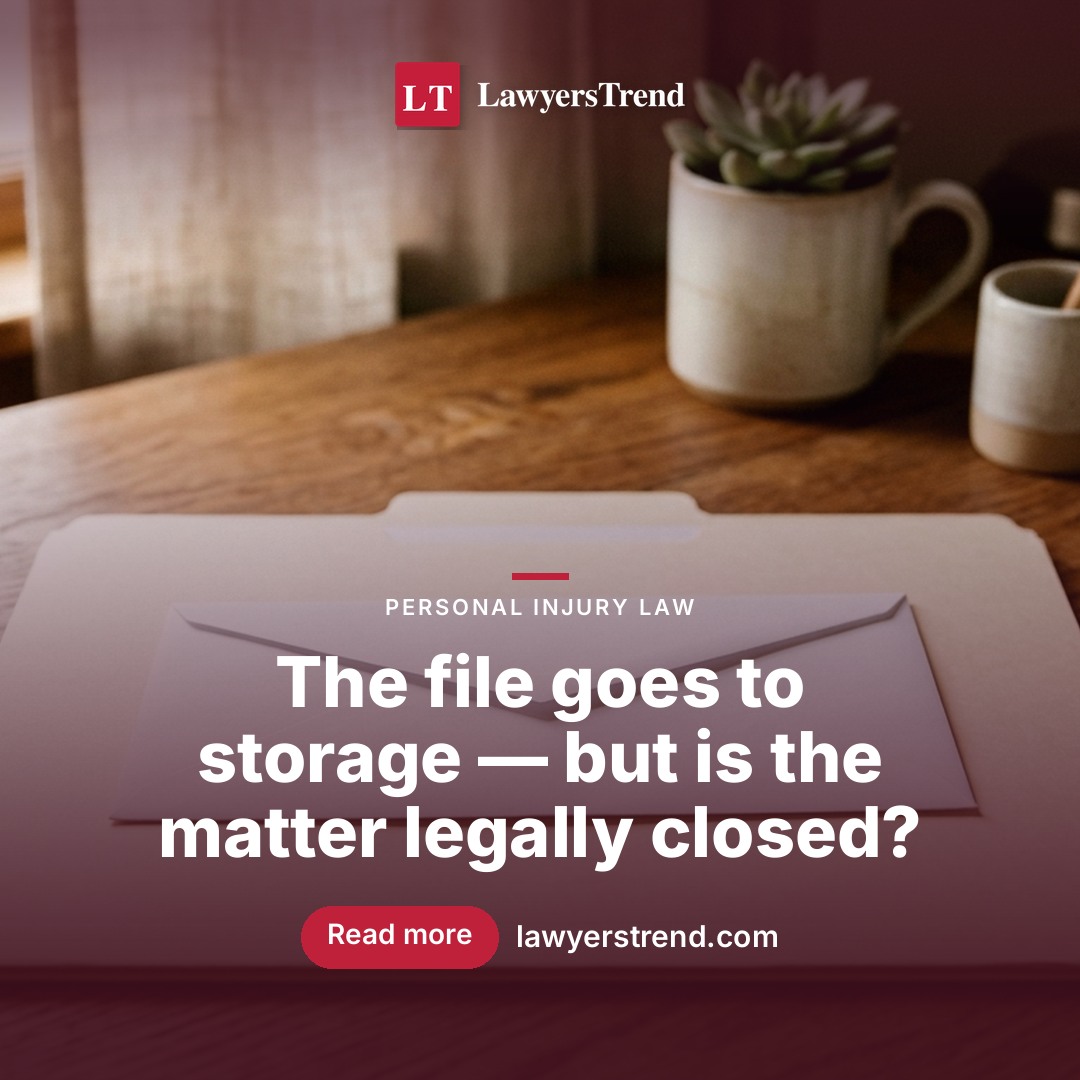 A sealed envelope resting on a closed manila file folder on a lawyer's desk in soft daylight.