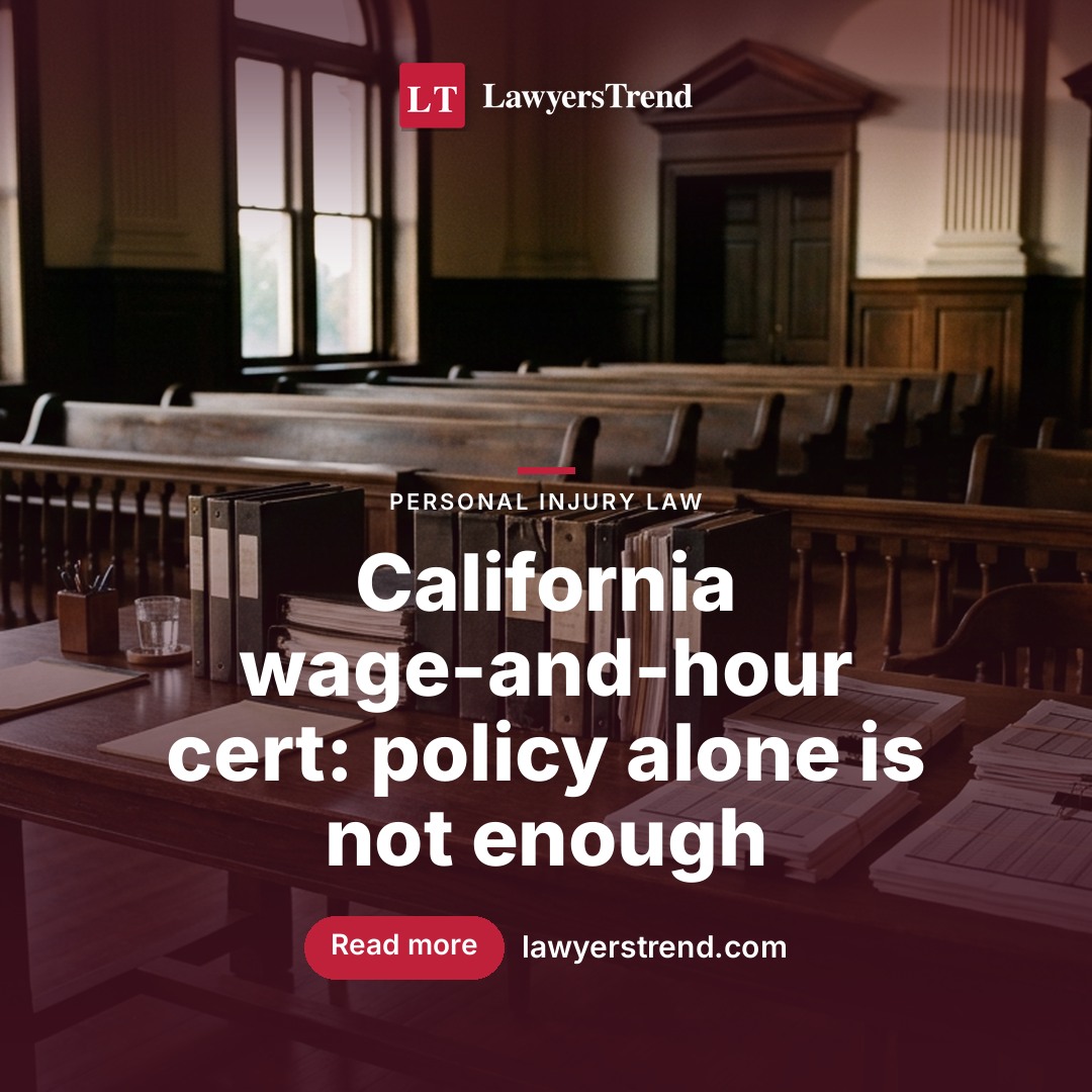 Empty courtroom benches and a counsel table stacked with binders and payroll printouts lit by early morning light